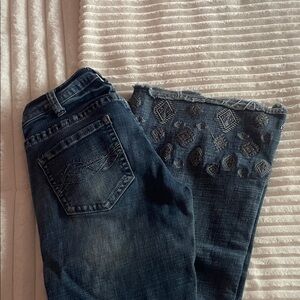 Woman’s cowgirl tuff jeans, trouser style, small stain near the pocket